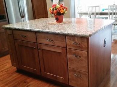 Granite-topped island in kitchen