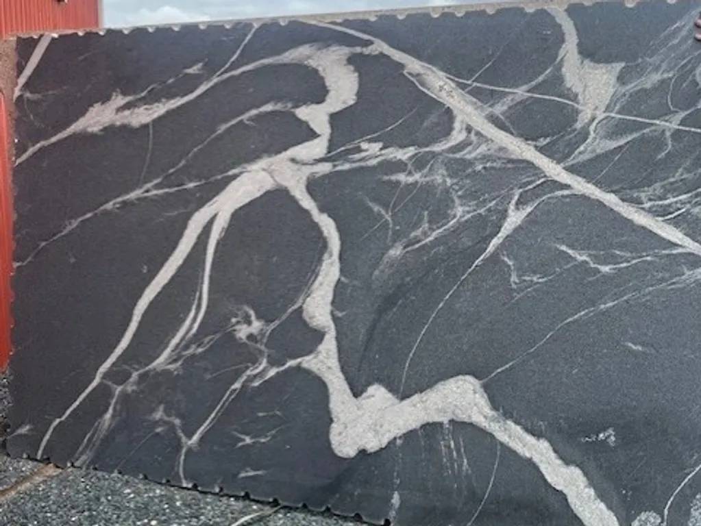 Dark marble slab with white veining