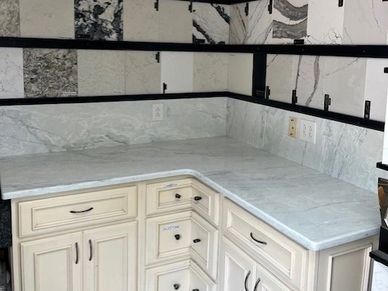 White cabinets and marble backsplash