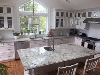 White kitchen cabinets and island